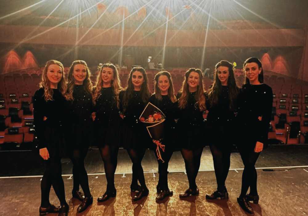 Elite Irish Dance performers outside a wedding venue, ready to entertain guests