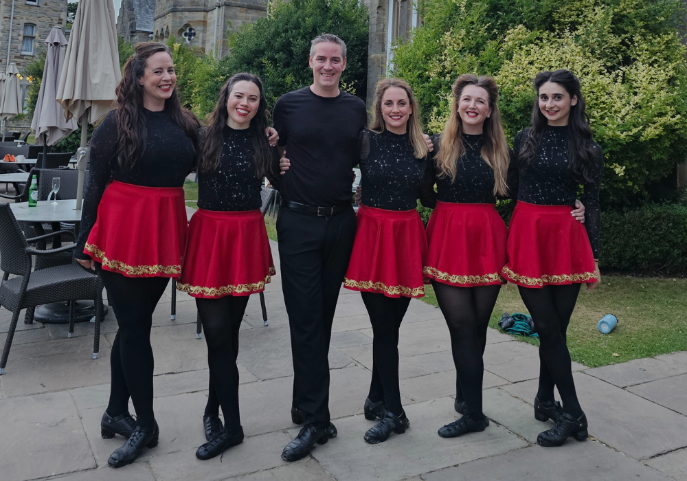 Elite Irish Dance performers outside a wedding venue, ready to entertain guests