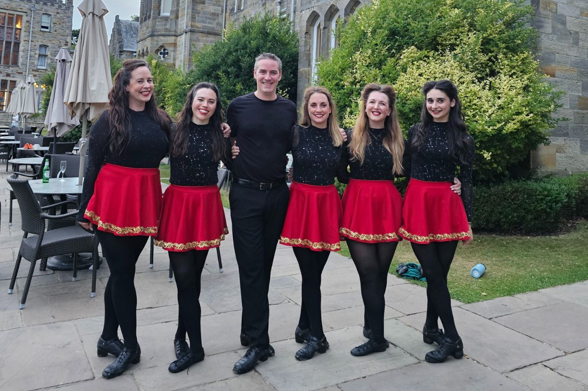 Elite Irish Dance performers outside a wedding venue, ready to entertain guests