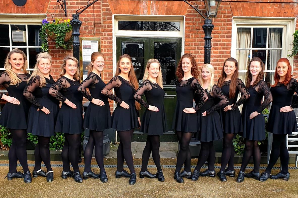 Elite Irish Dance performers outside a pub after a St. Patrick’s Day performance